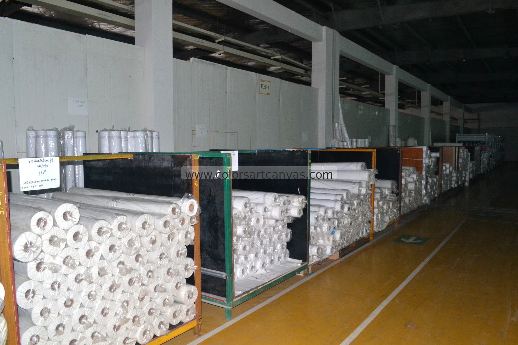 Finished printable canvas rolls prepared for batch quality control at Colors Art
