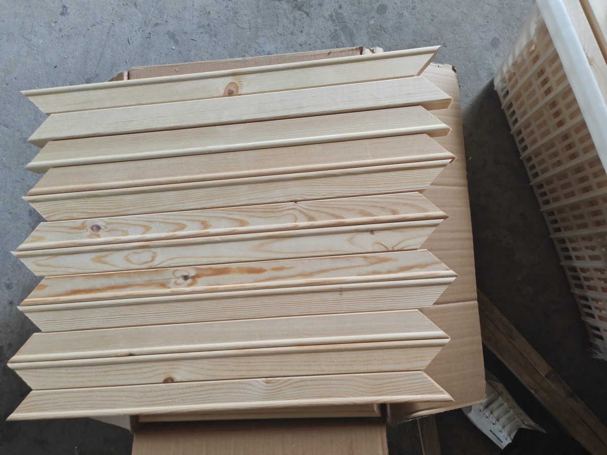 45 degree miter joint inspection on a wooden canvas stretcher frame