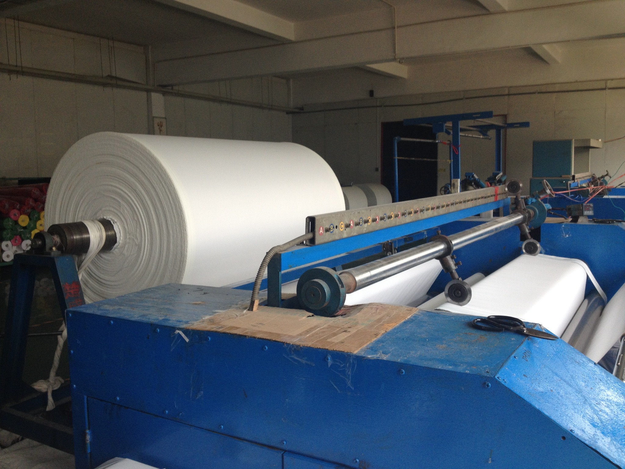 Bulk printable canvas roll production at Colors Art factory